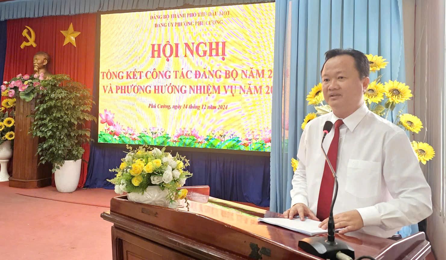 A person standing at a podiumDescription automatically generated