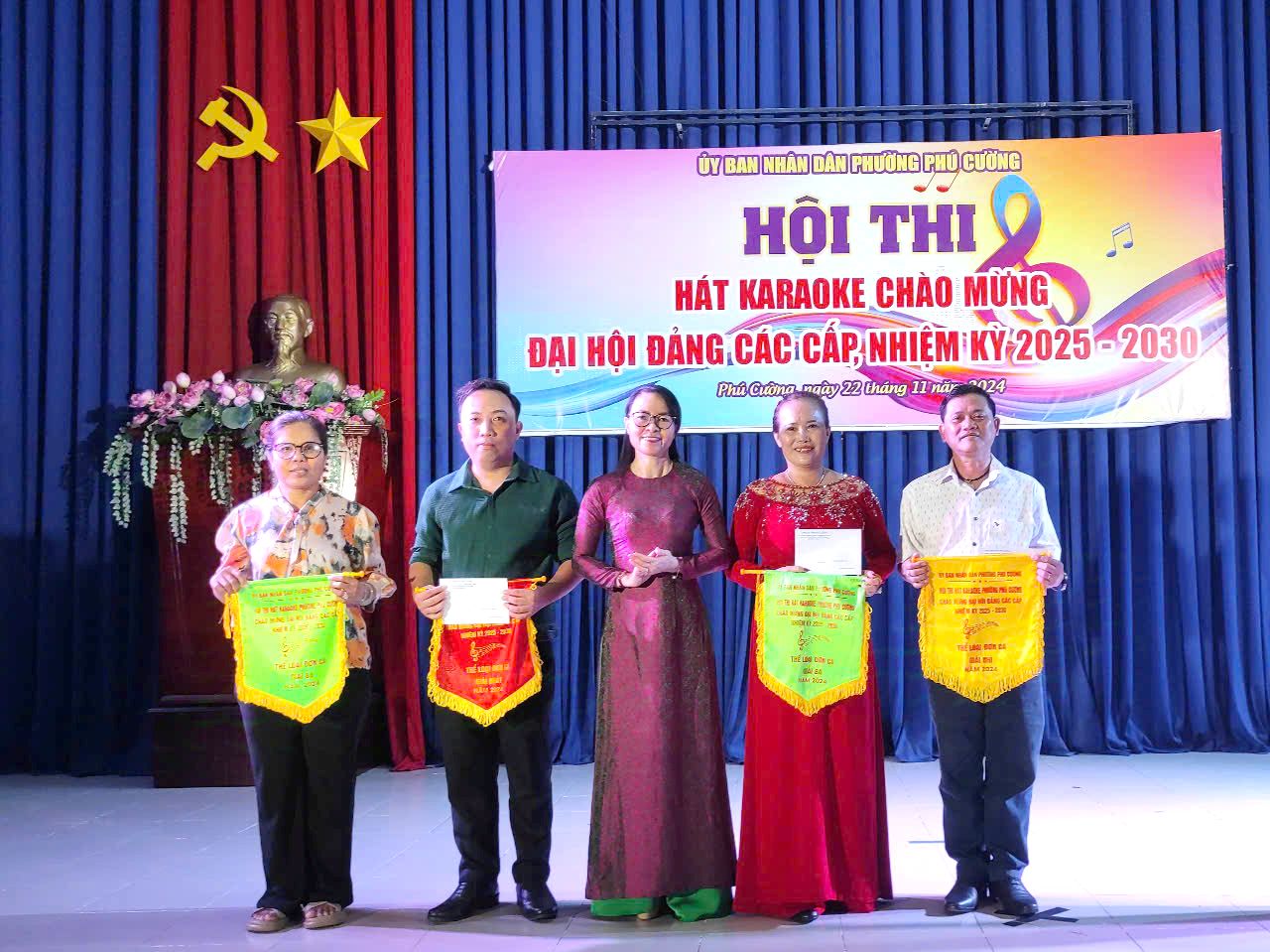 A group of people holding bannersDescription automatically generated