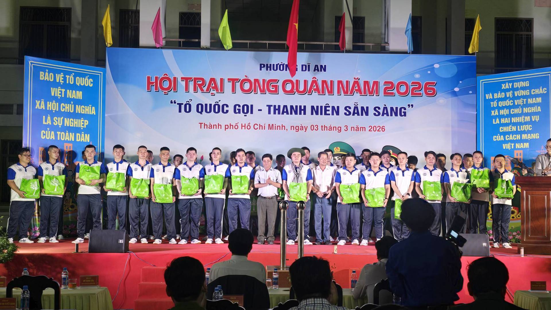 C&oacute; thể l&agrave; h&igrave;nh ảnh về một hoặc nhiều người, c&aacute;i bục v&agrave; văn bản cho biết 'BẢO VỆT BẢOVETQU&Oacute;C TỔ QUỐC VIỆT NAM X&Atilde; HỘI CHỦ NGHĨA L&Agrave; SỰ NGHIỆP CỦA TO&Agrave;N D&Acirc;N PHƯỞN DIAN D&Igrave; AN HỘI TRẠI T&Ograve;NG QU&Acirc;N NĂM 2026 "TỔ QUỐC GỌI THANH NI&Ecirc;N SẮN SẢNG" " " " Th&agrave;nh phố Hổ Ch&iacute; Minh, ng&agrave;y 03 th&aacute;ng 3 năm 2026 X&Aacute;Y DỤNG V&Agrave; BẢOV VỪNG CHẮC &tau;ό QUỐC VIỆT NAM XA HỌI H&Ocirc;IC NGHĨA LA HA&Iota; HAI NHI&Ecirc;N หบู LƯỢC CỦA C&Aacute;CH MANG VIỆT NAM'