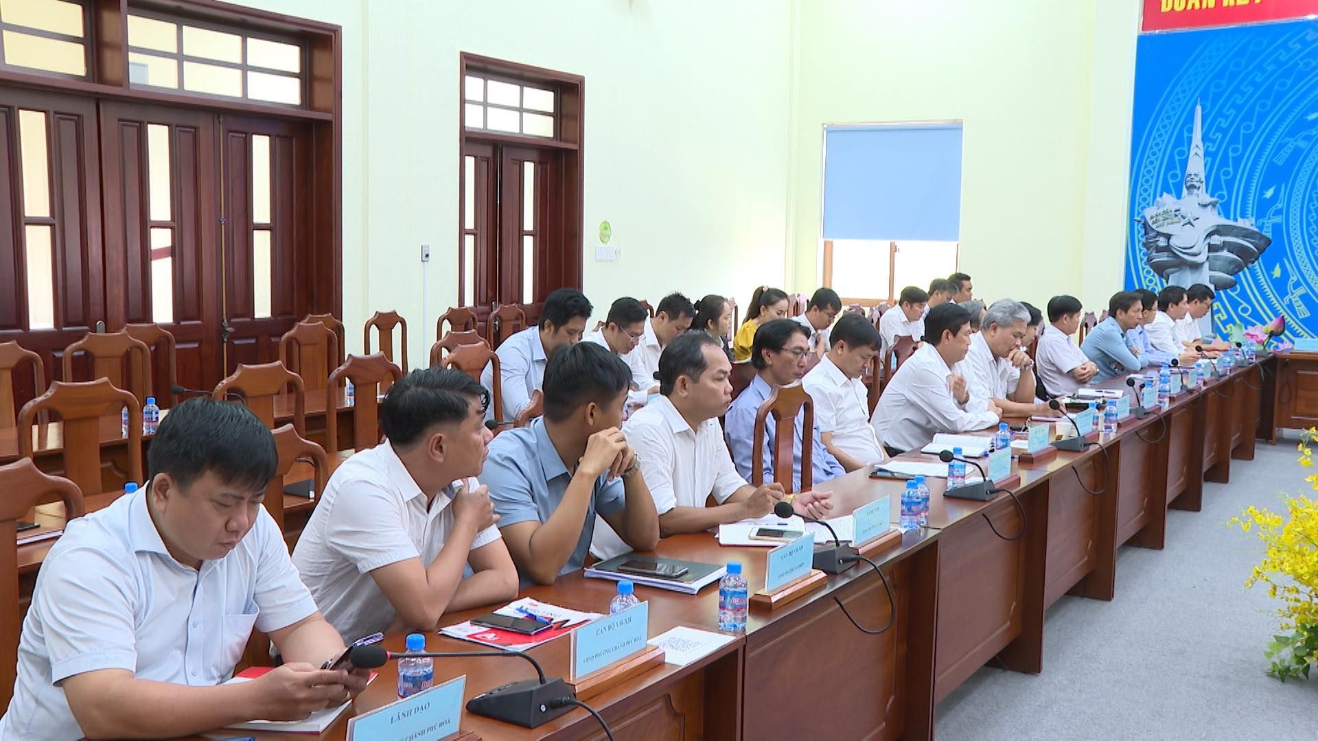 May be an image of 4 people, people studying and text