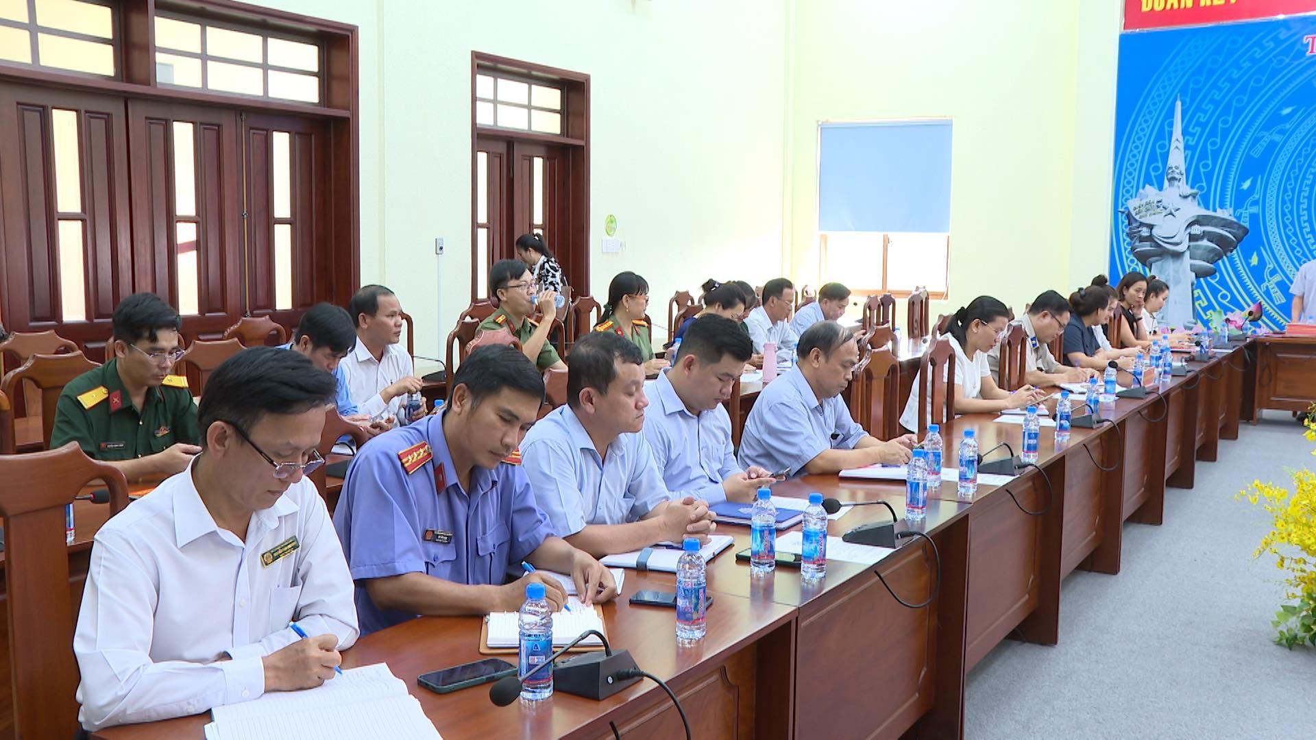 May be an image of 9 people, people studying and text