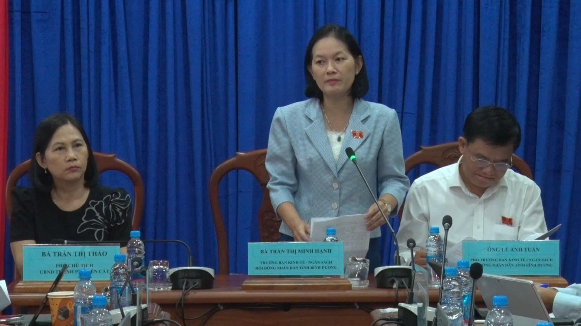 May be an image of 3 people, dais and text